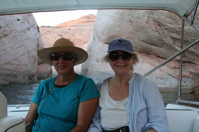 Donna and Carol in motorboat racing through Labyrinth Slot Canyon