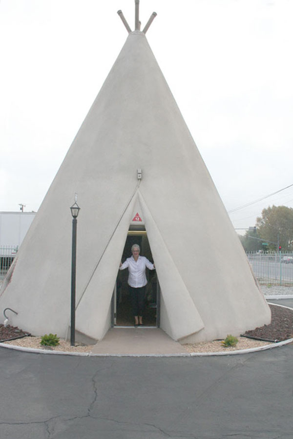 Donna in the doorway of her wigwam